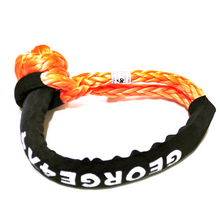 Load image into Gallery viewer, Soft Shackles are an alternative to traditional steel shackles and are made of Synthetic rope (well known as Dyneema/Spectra etc). They are Lighter, Stronger, and more flexible. Button knot Orange Soft Shackle*1pc Hand spliced in Australia, Tested by NATA-accredited lab Super lightweight, can float in water UV-resistant, waterproof and more durable Protective sleeve fitted Features: 11mm*55cm/60cm/65cm/70cm/75cm Breaking Strength: 18000kg