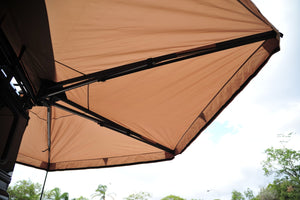GEORGE4X4 270 Free Standing Awning perfect for smaller vehicles like the Suzuki Jimny, Jeep Wrangler, and Defender 90
Built-in LED Lighting: Illuminate your campsite with integrated LED lights powered by a 5m USB cable. Optimal Dimensions: 2m length with a 2m radius—small enough to be versatile, yet spacious enough for comfort. Durable Material: Made from rugged 280g polycotton canvas, ensuring waterproof protection and durability. Lightweight Design: Weighs only 23kg, making it easy to transport and set up