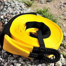 Load image into Gallery viewer, To rescue a vehicle stuck in sand or mud, use a snatch strap, which can stretch 10-20% under load and stores kinetic energy. George4x4 snatch straps are made of top quality 100% nylon Highly elastic that can be elongated up to 20% UV-resistant, waterproof and more durable Both ends have reinforced eyelets Comes with 2pcs removable sleeves VISIBLE colour-yellow. 11000kg*9m/3m